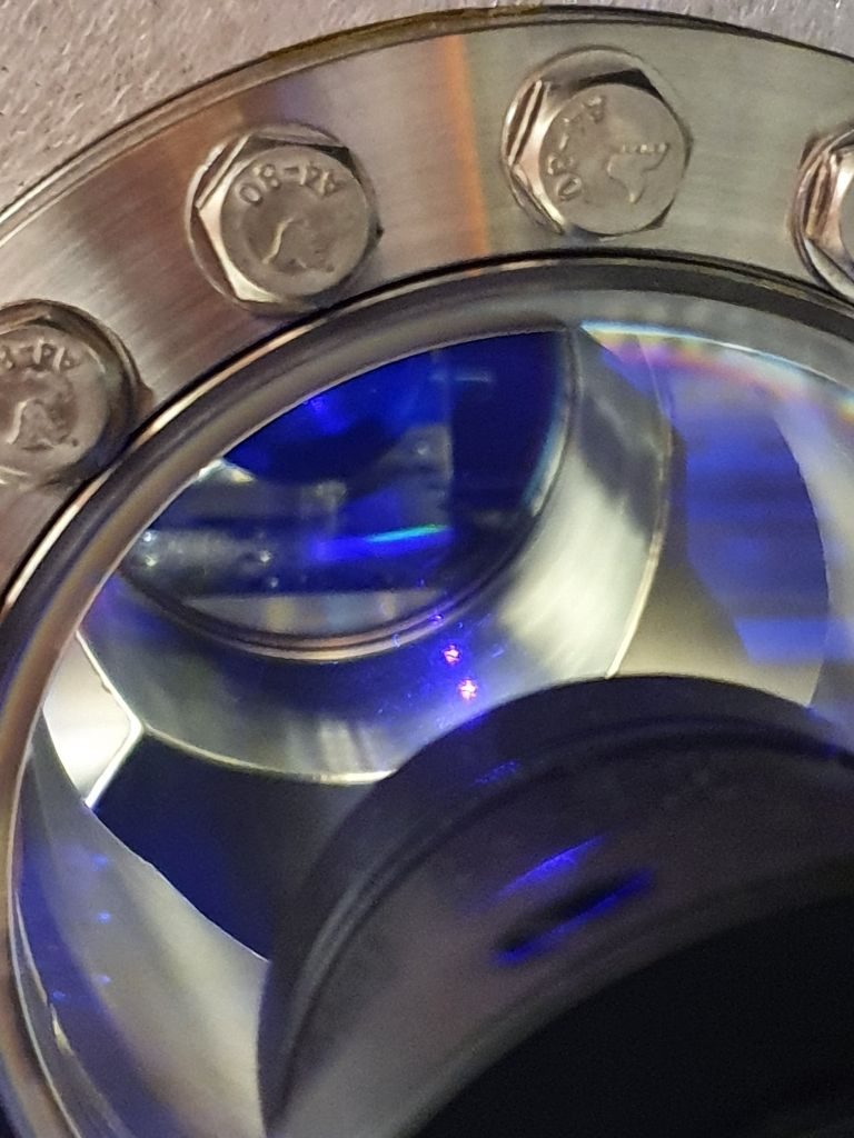 Green fluorescence inside a blue ytterbium magneto-optical trap