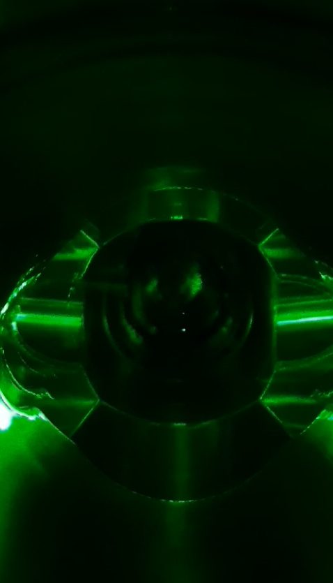 Ytterbium magneto-optical trap fluorescing green at 556 nm
