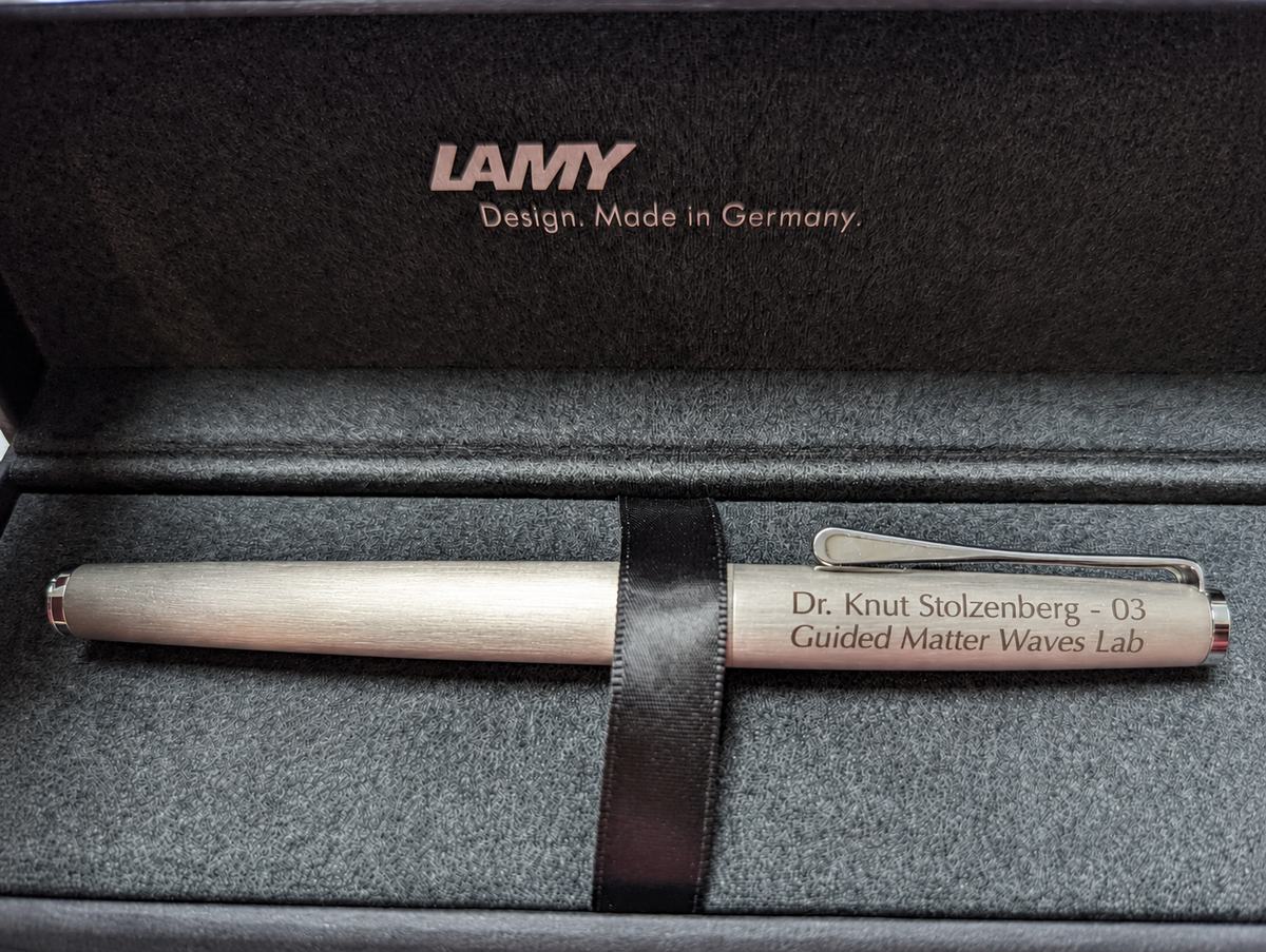 An engraved fountain pen in its box